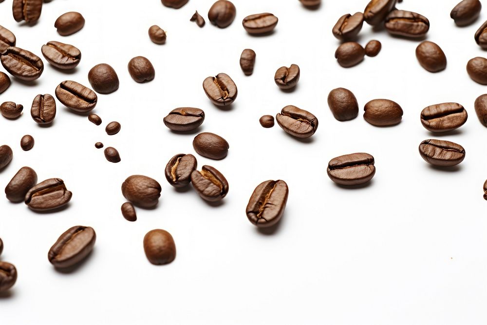 Scattered roasted coffee beans isolated