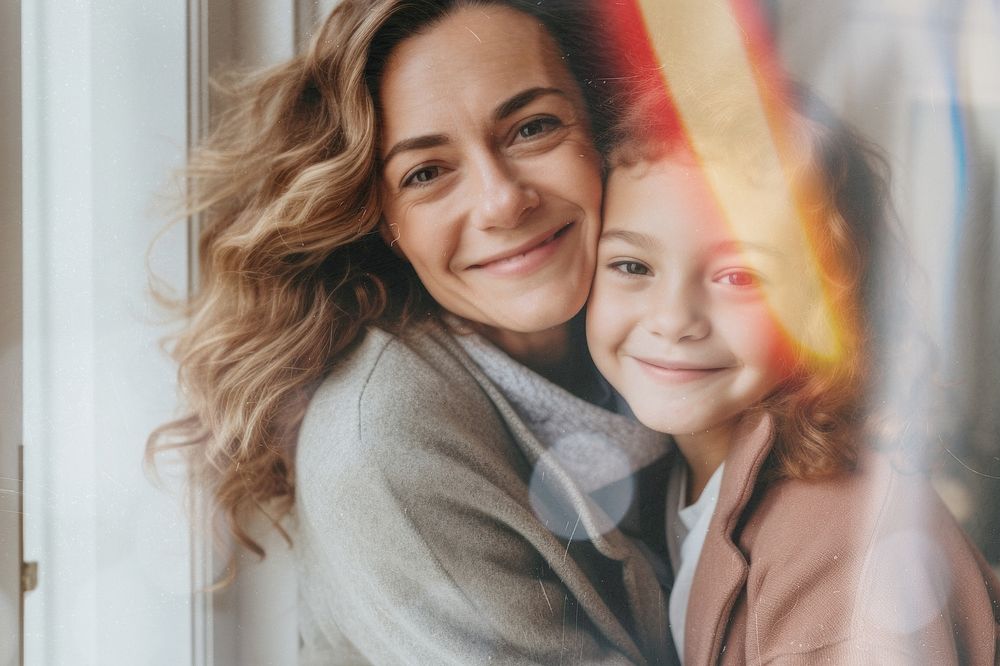 Mother and daughter smiling together