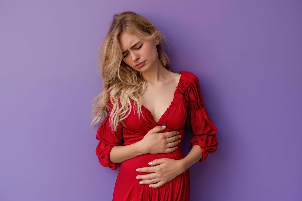 Woman in red dress suffering