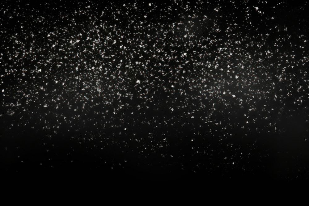 Falling snowflakes on black background