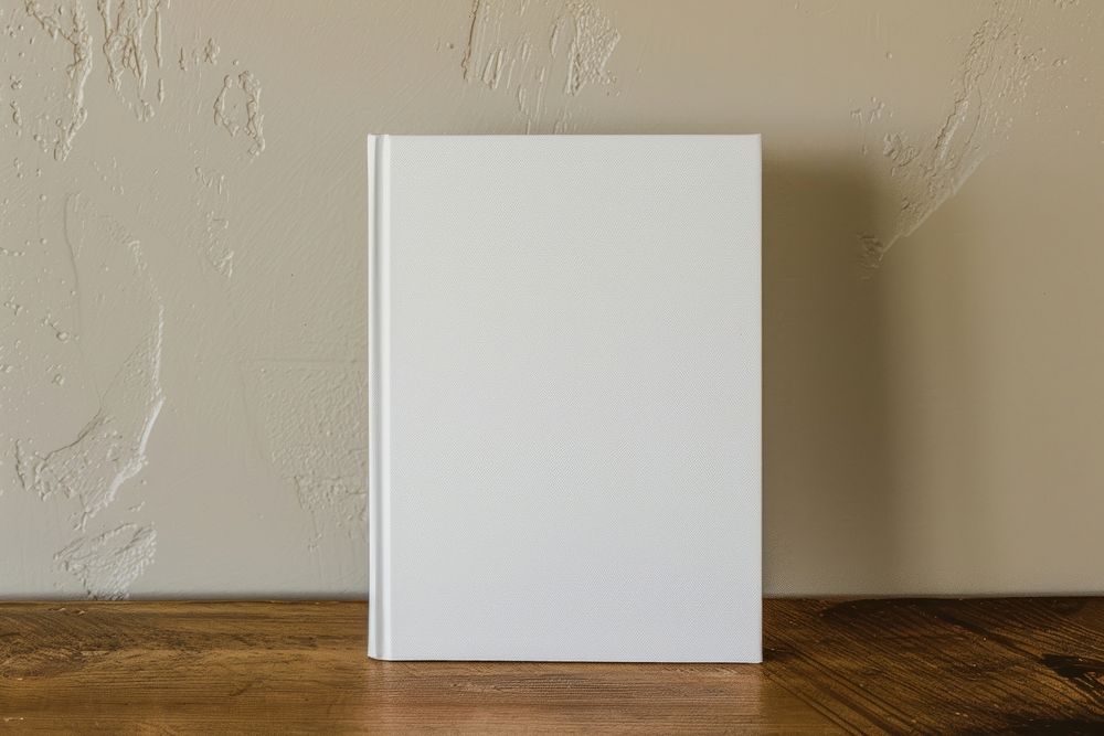 Blank hardcover book on table