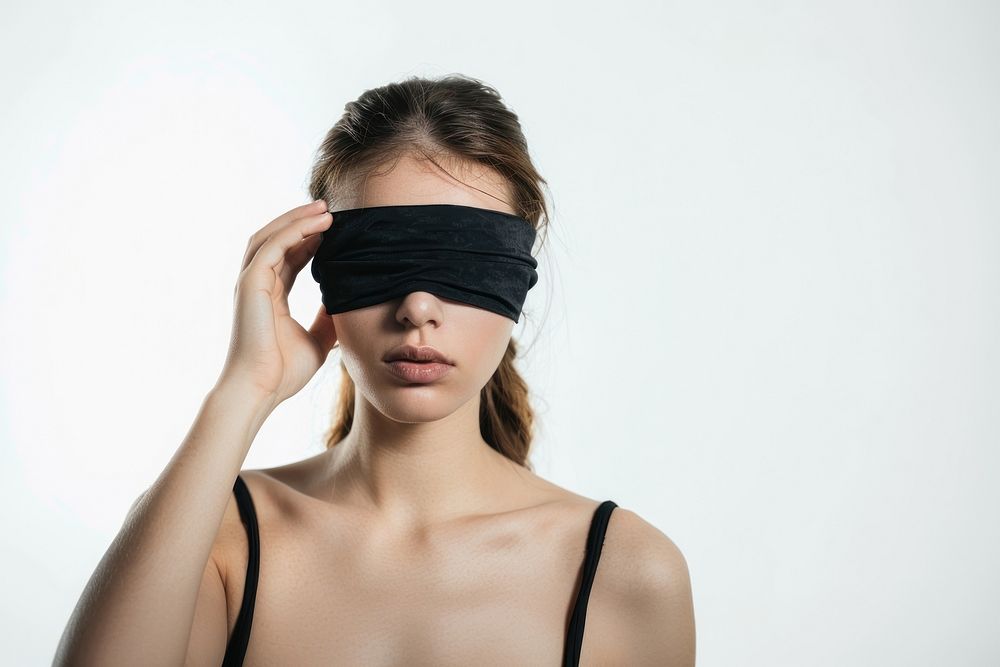 Blindfolded woman in black attire