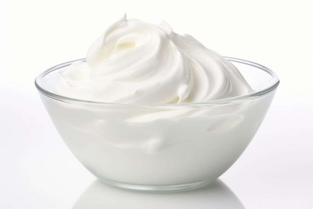 Whip cream in white bowl dessert beverage yogurt.