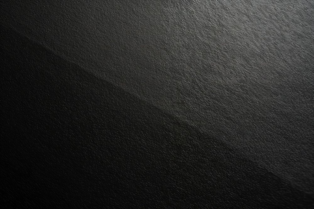 Dark textured black background surface