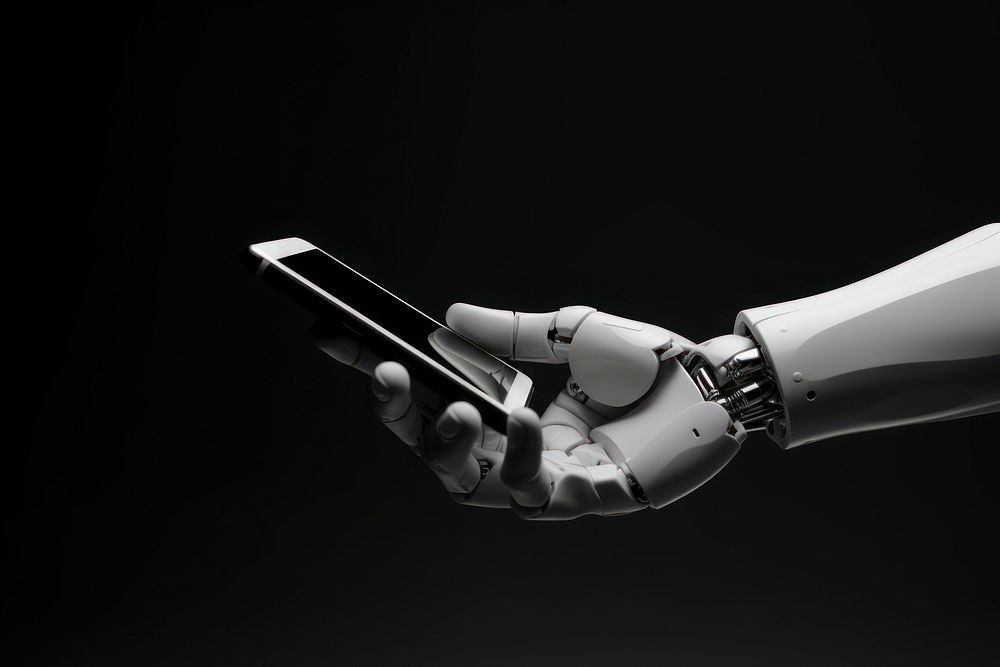 Robot hand holding smartphone technology