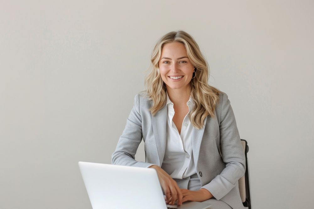 Professional woman smiling laptop