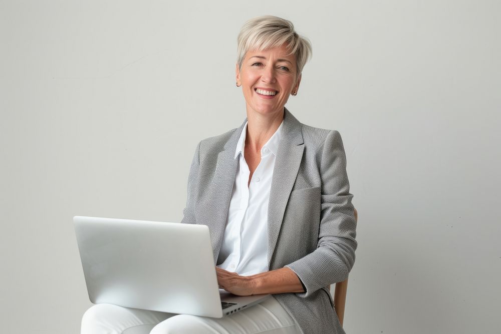 Professional woman with laptop smiling