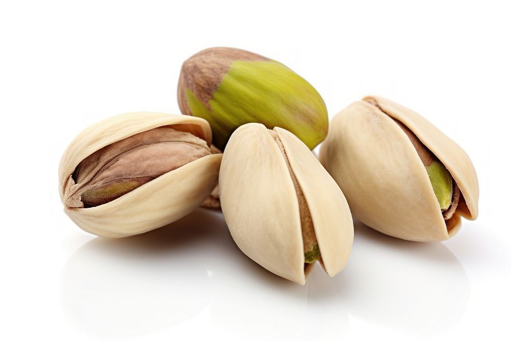 Fresh pistachios on white background