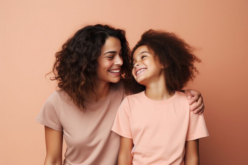 Happy mother and daughter smiling