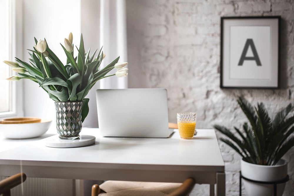 Modern workspace with white tulips