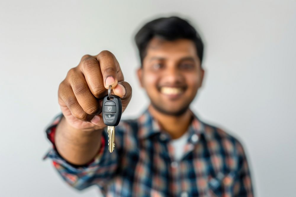 Man holding car keys smiling