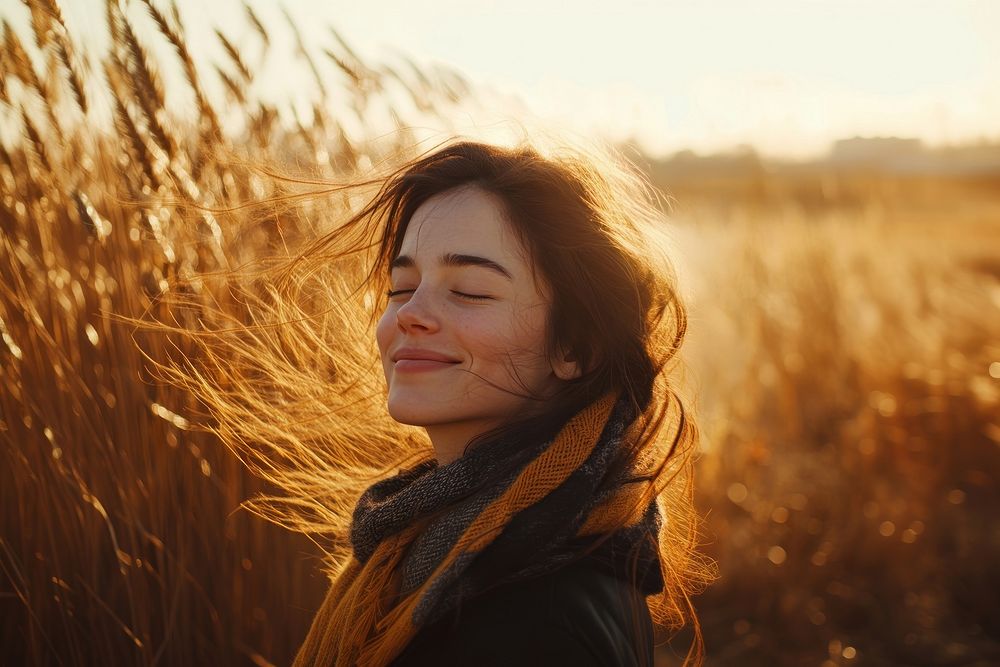 Side view photo of asian woman smiles with her eyes closed portrait autumn sunset.