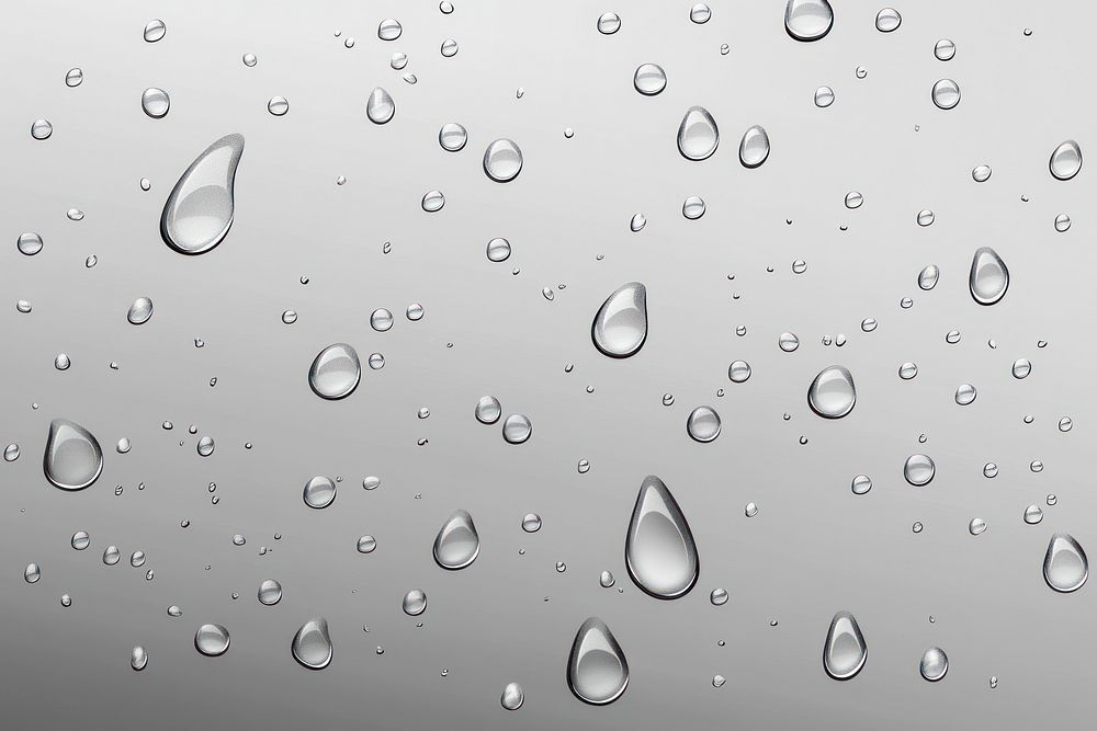 Water droplets on a transparent glass surface water background drops.