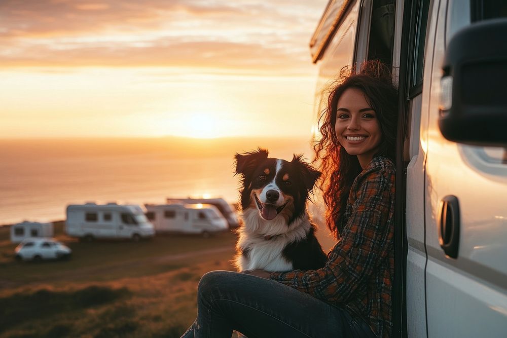 A beautiful mixed-race woman sitting on the side of her camper van vacation caravan photo.