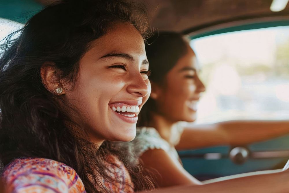 Joyful friends driving together