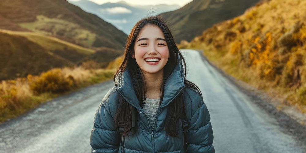 Happy young woman wearing a down jacket photo photography clothing.