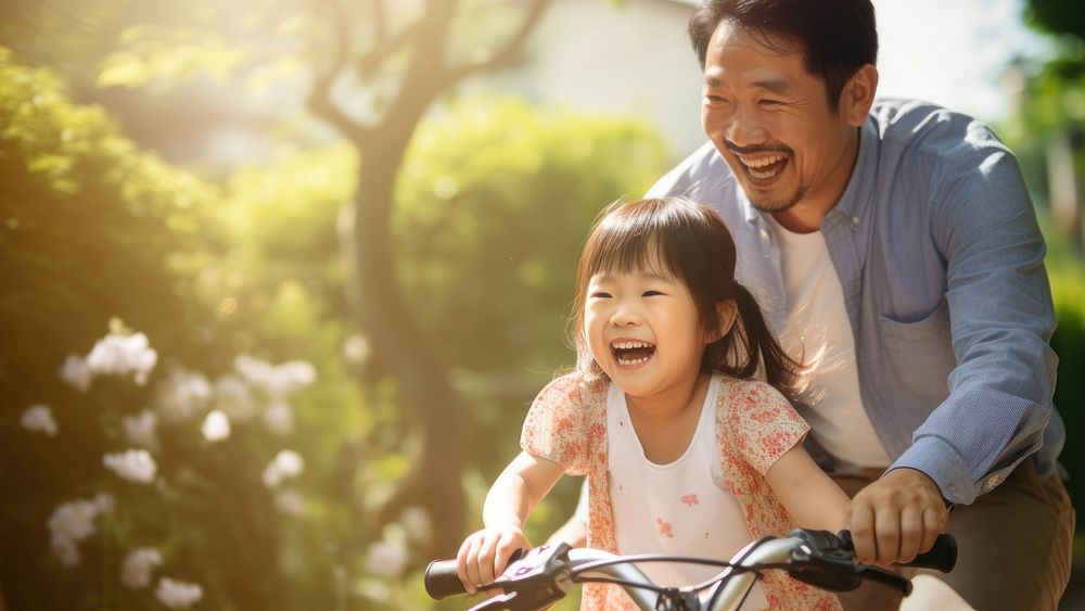 Joyful father-daughter bike ride