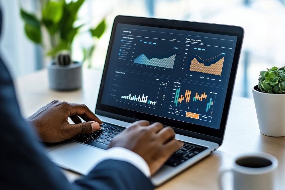 Businesswoman using a laptop screen professional analytics.