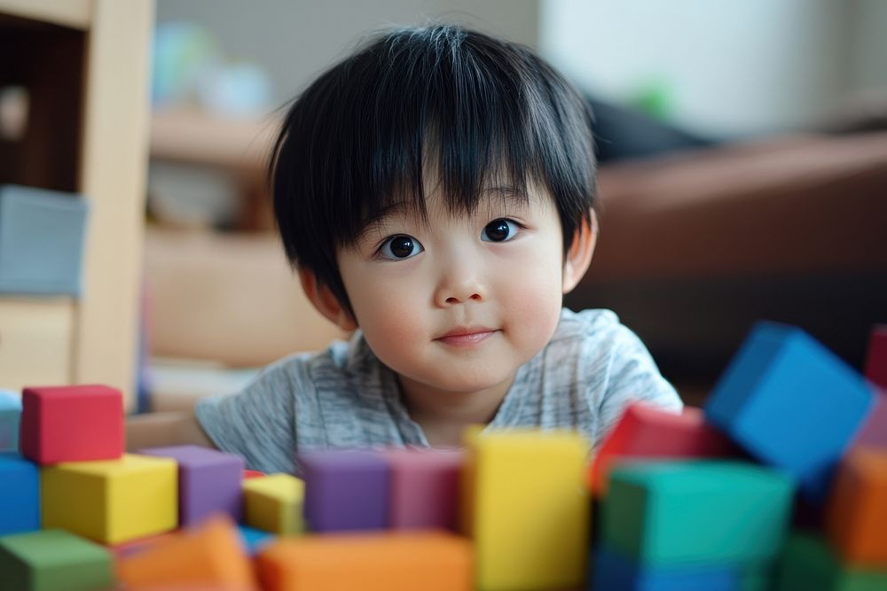 Young kid playing with blocks photography toys development.