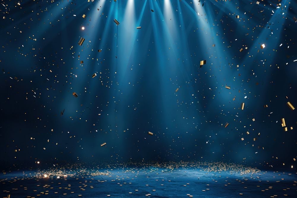 A blue background with spotlights shining down lighting confetti backdrop.