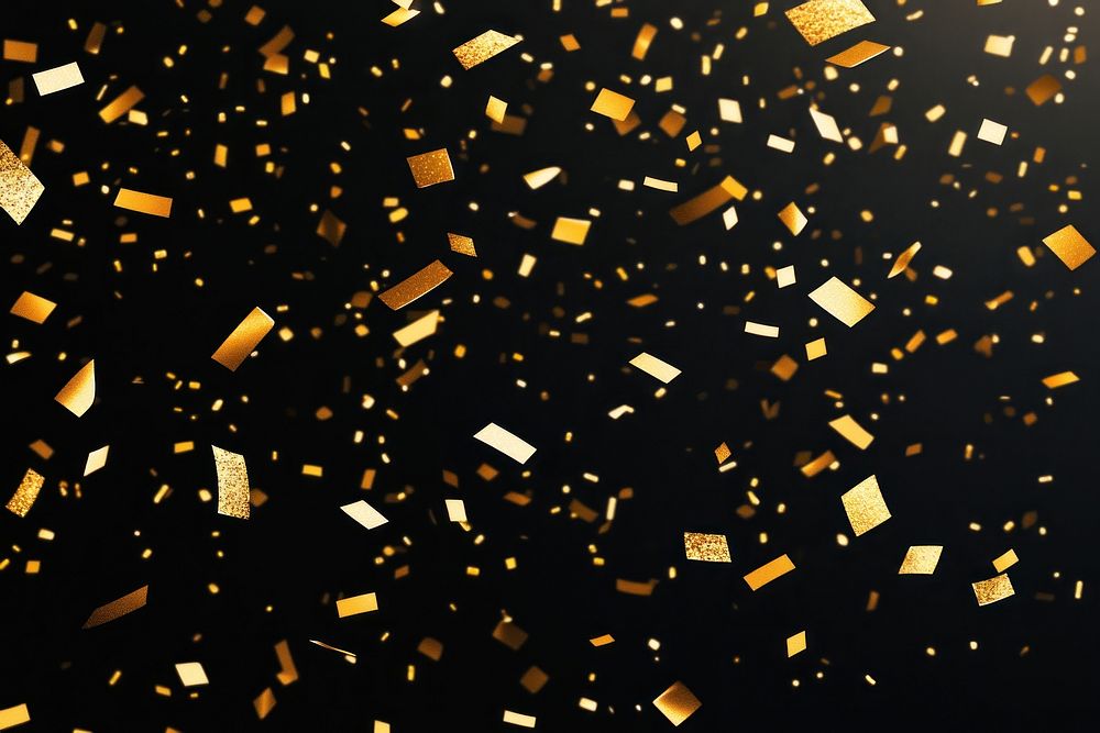 A black background with golden confetti falling all over it celebration atmosphere festive.