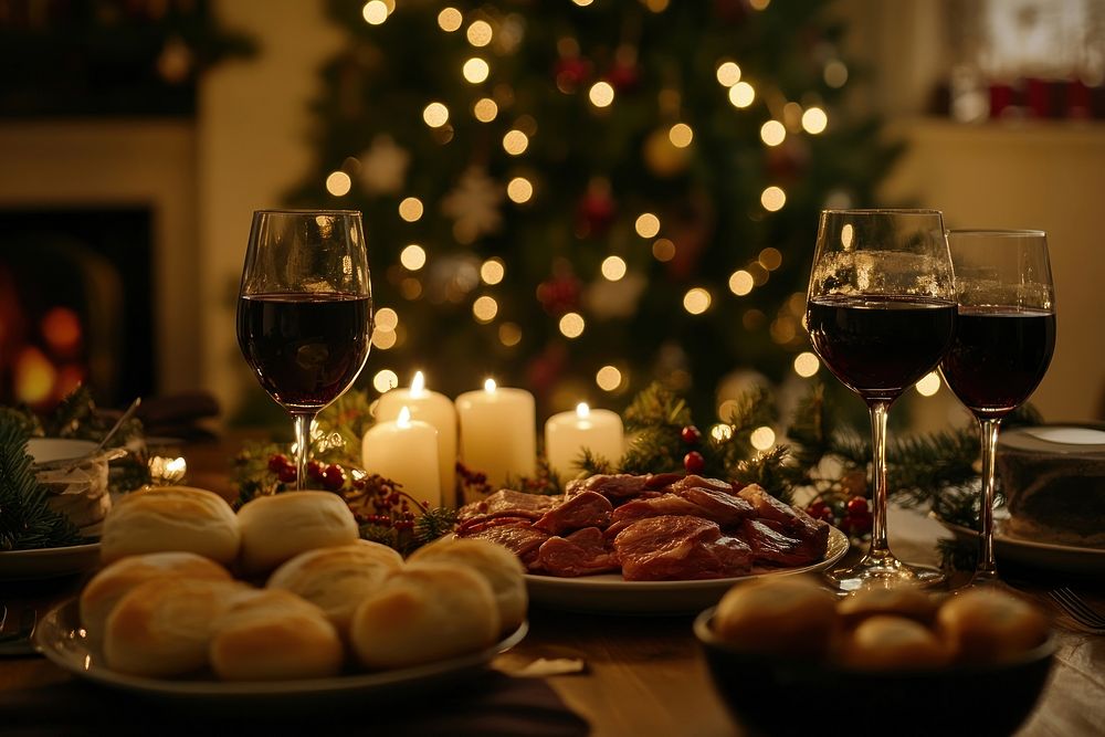 Christmas dinner with dishes and meat on the table wine christmas glasses.