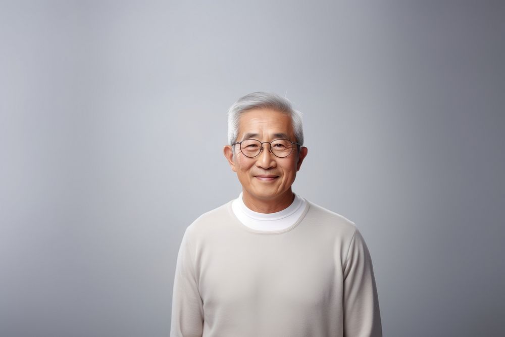 An attractive asian old man portrait glasses photography.