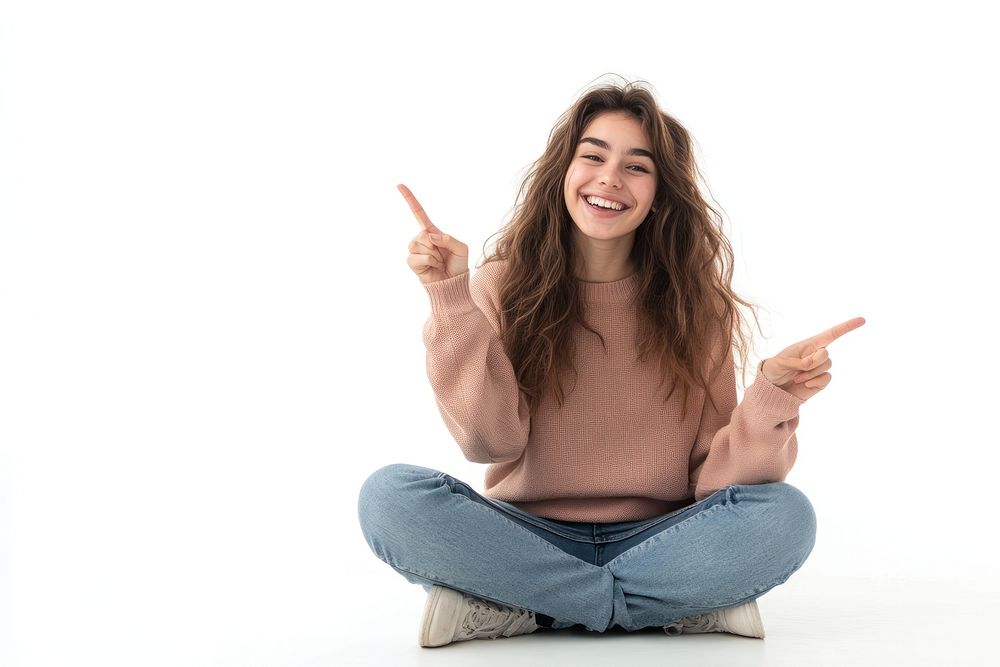 Happy young woman sitting fingers background pointing.