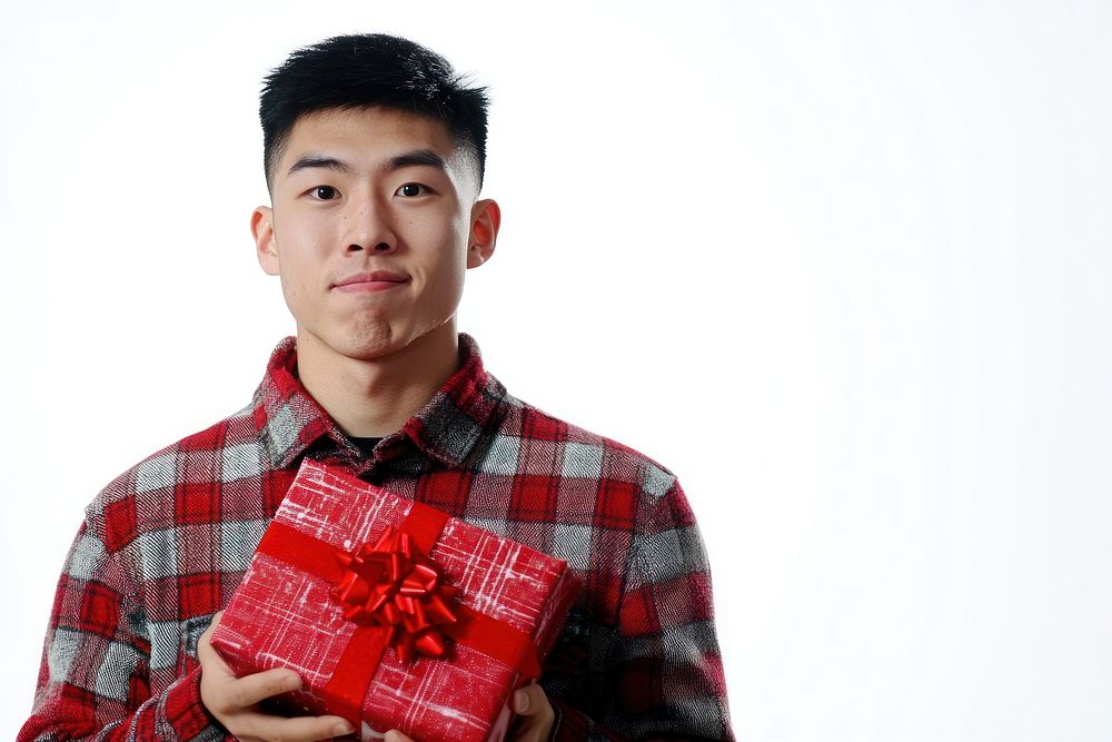 An asian man carry a christmas gift background holiday happy.