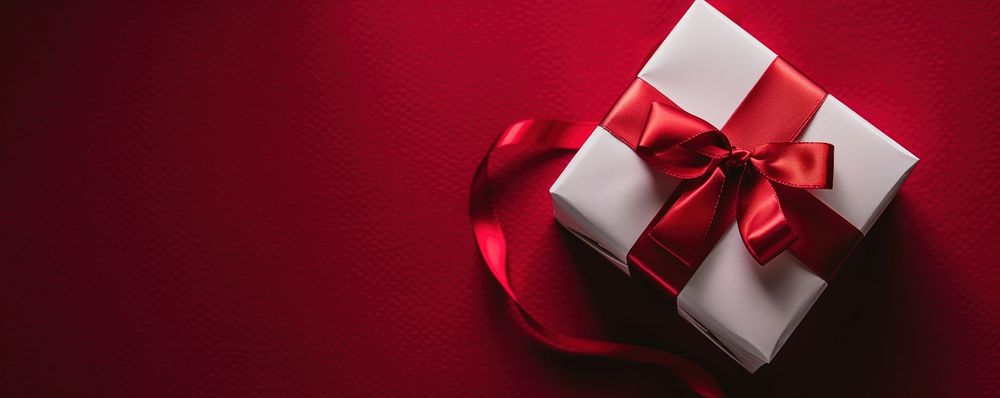 Gift box with red satin ribbon present holiday white.