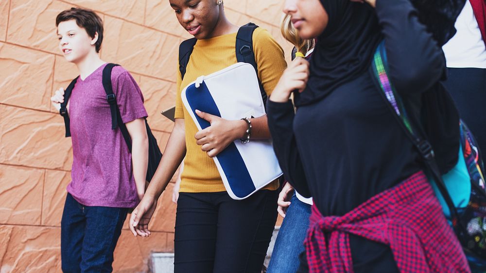 Diverse group of students walking. Students with backpacks, diverse ethnicities. Group of students walking together, diverse…