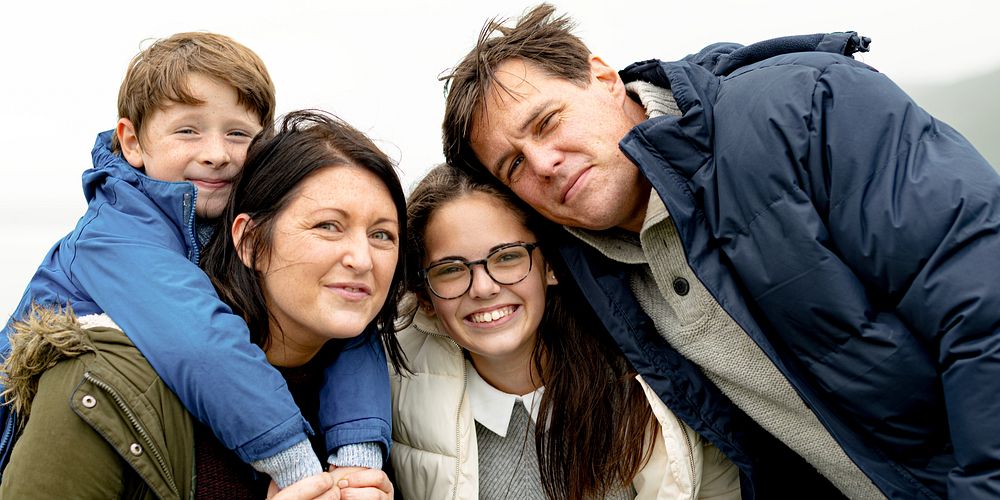 Happy Caucasian family outdoors, mother, father, son, and daughter. Family smiling, enjoying nature. Family trip outdoor…