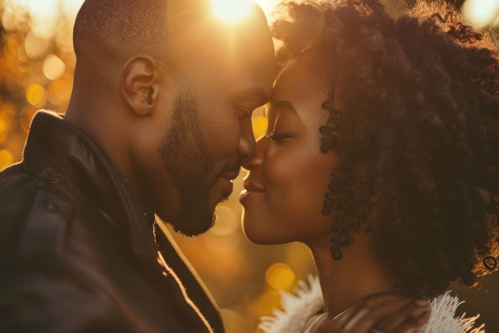 Black couple portrait kissing wedding.