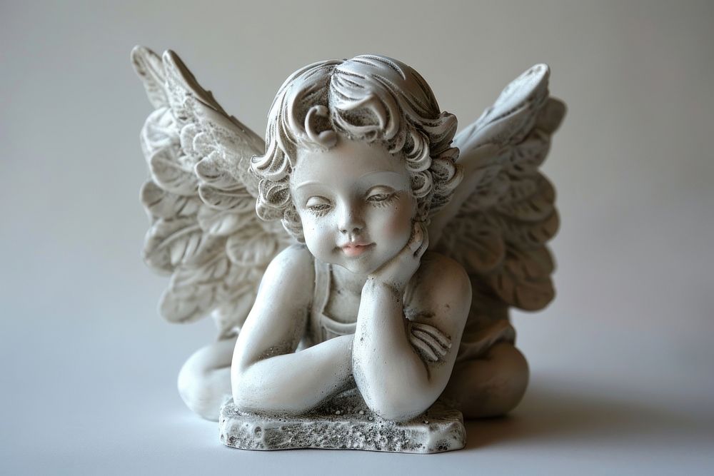 Baby angel guardian statue figurine representation spirituality.