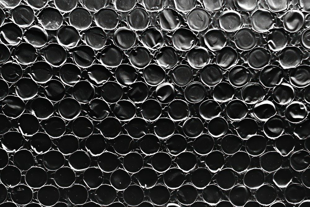 Bubble wrap texture black backgrounds repetition.