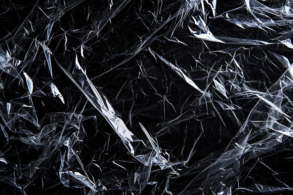 Lossy plastic wrapped texture backgrounds black black background.