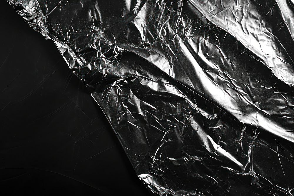 Foils plastic wrap backgrounds black monochrome.