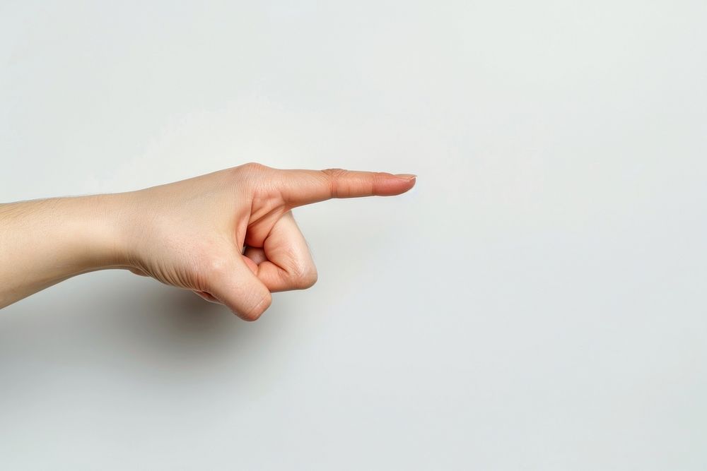 Index finger hand pointing white background.