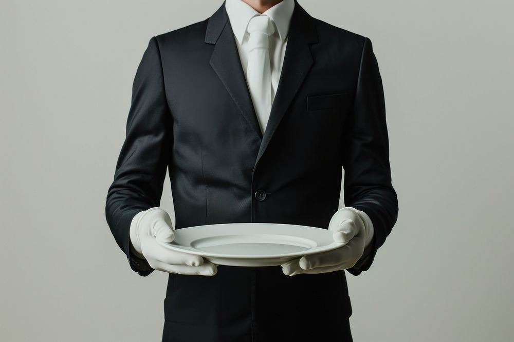 Plate standing holding tuxedo.