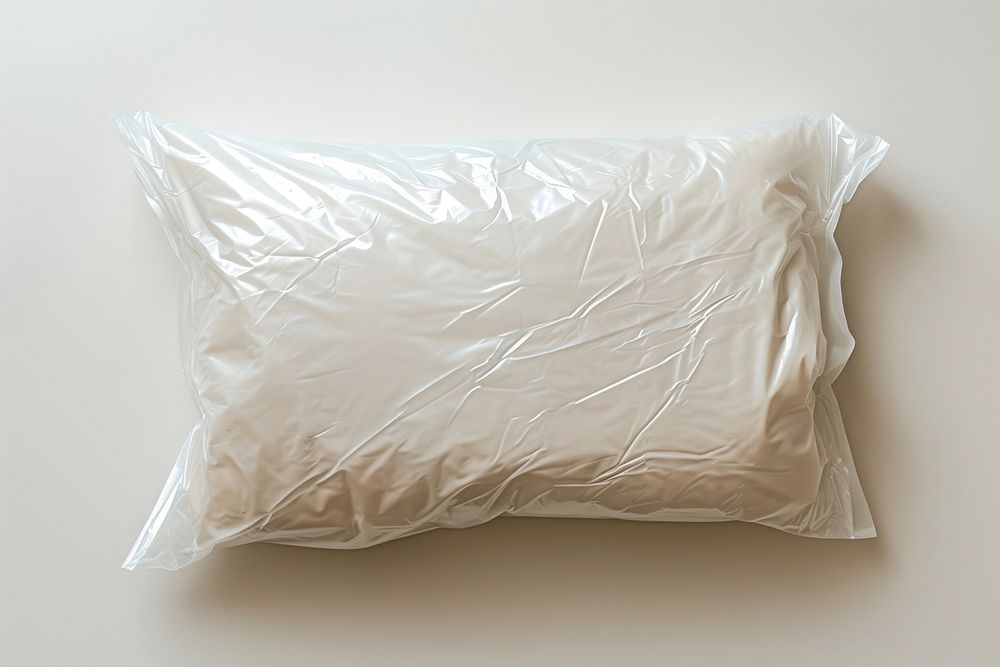 Plastic wrapping over cushion white crumpled wrapped.