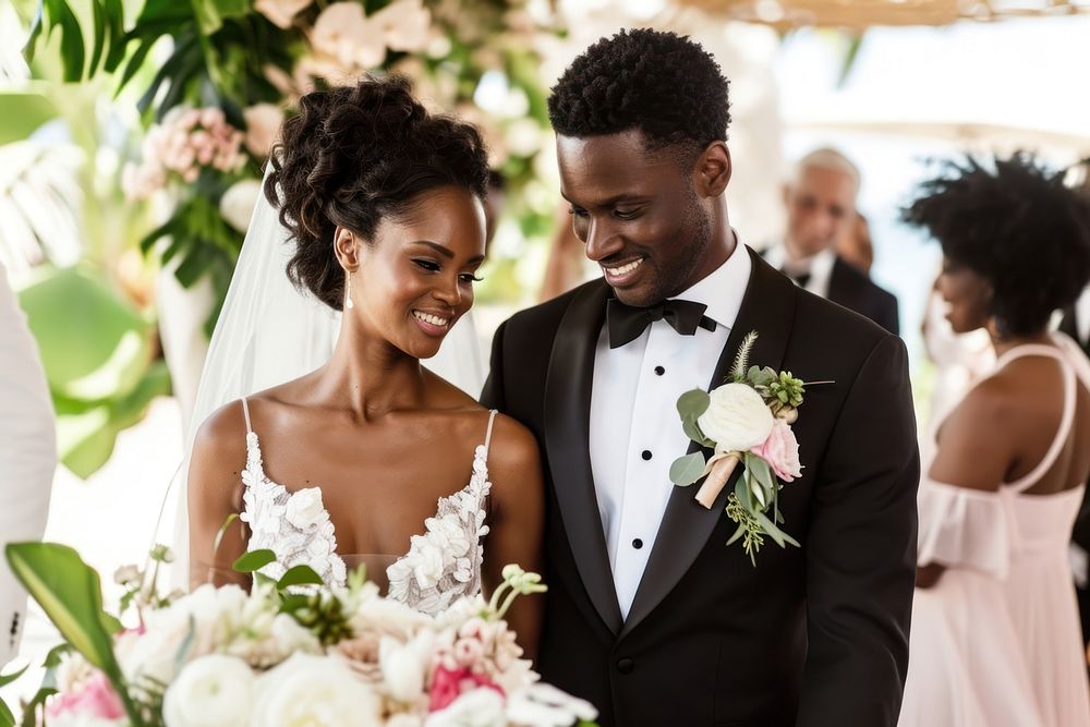 Black couple walking down the aisle wedding tuxedo bride.
