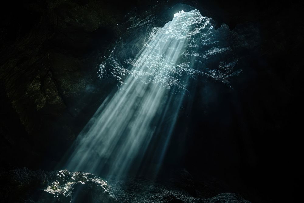 Transparent Cave sunlight reflections cave waterfall outdoors.