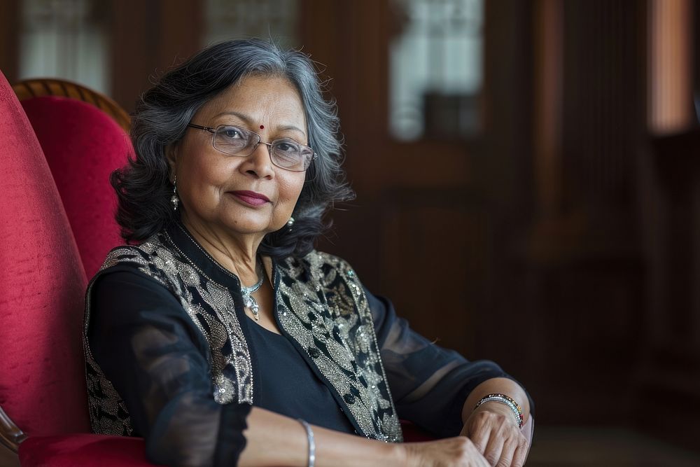 Senior indian businesswoman necklace portrait glasses.