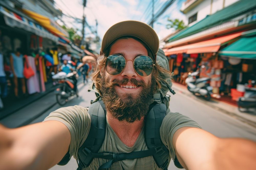 A european backpacker take a selfie portrait travel street.