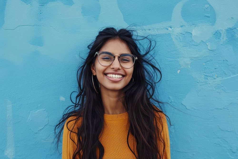 Indian american woman portrait glasses smile.