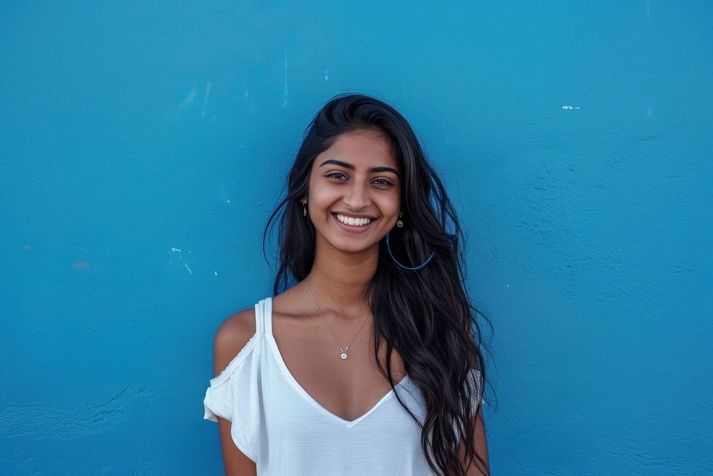 Indian american woman smile happy blue.