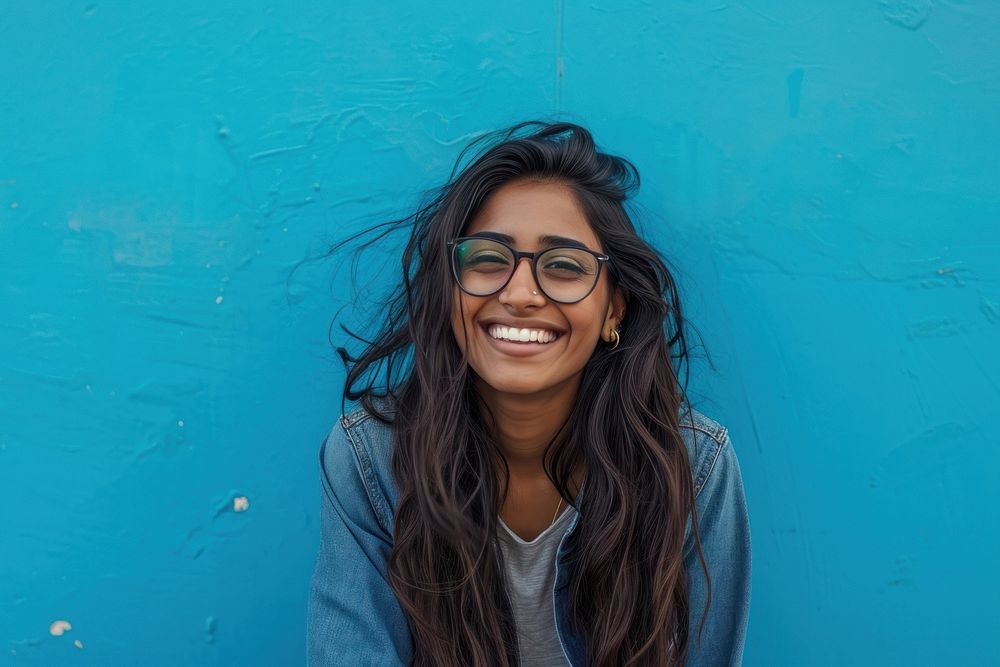 Indian american woman glasses smile happy.