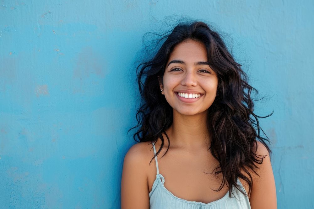 Indian american woman smile happy blue.