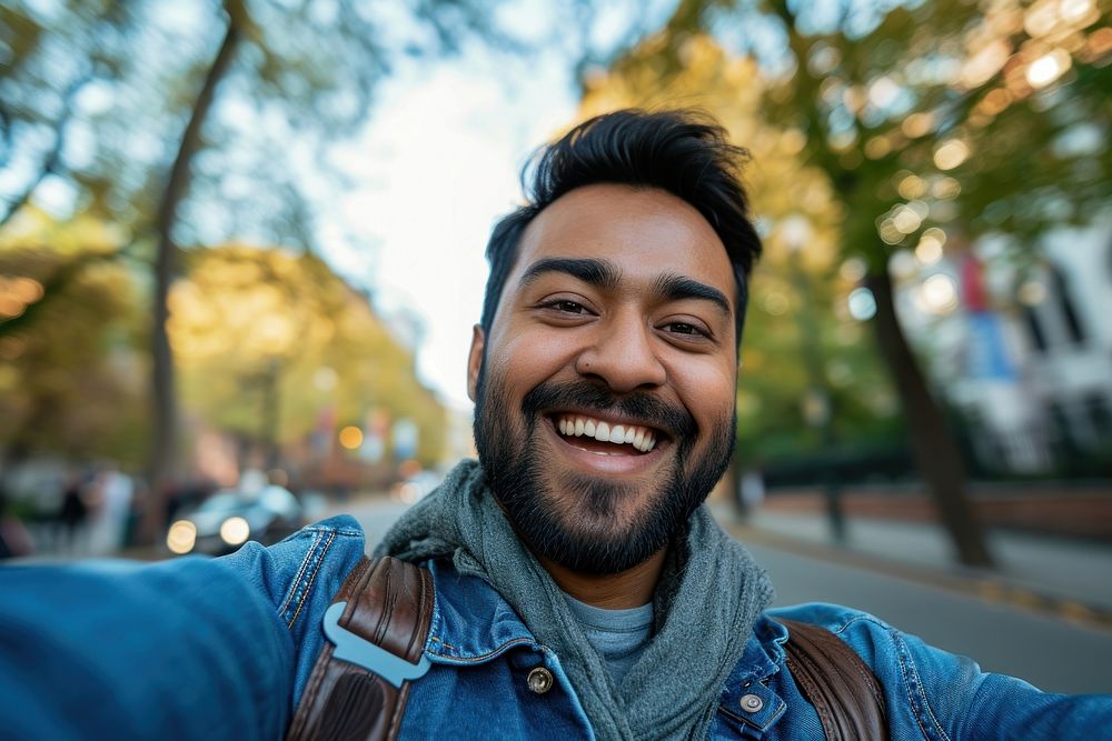 Indian american man selfie laughing clothing.