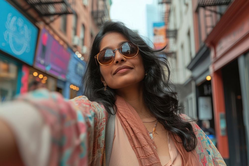 Indian american woman sunglasses portrait selfie.